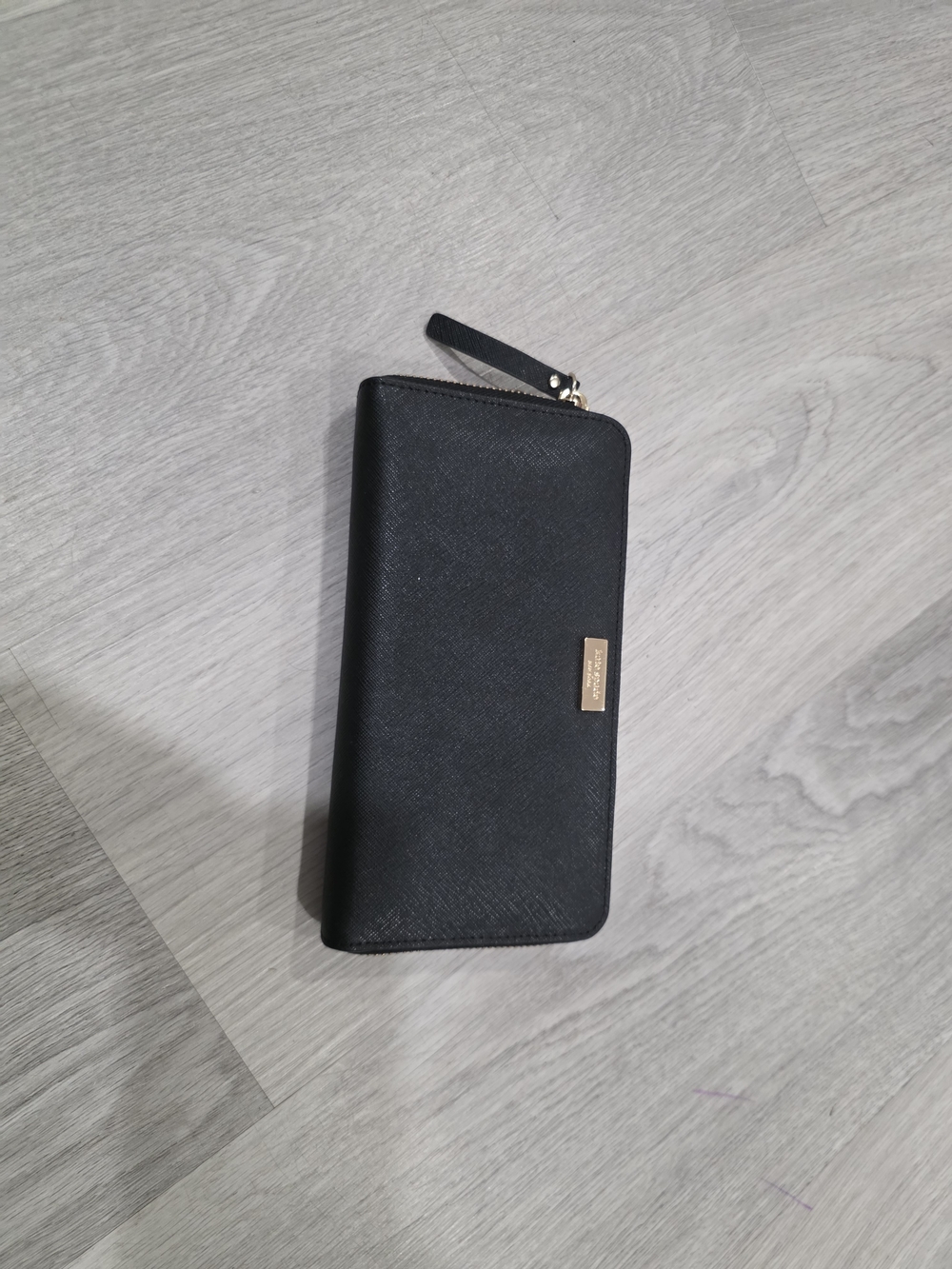 kate spade Black Zip-Around Leather Wallet with Gold Plaque